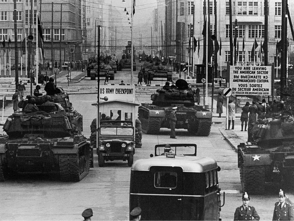 https://commons.wikimedia.org/wiki/Category:You_are_leaving_the_American_Sector_sign_at_Checkpoint_Charlie#/media/File:US_Army_tanks_face_off_against_Soviet_tanks,_Berlin_1961.jpg
